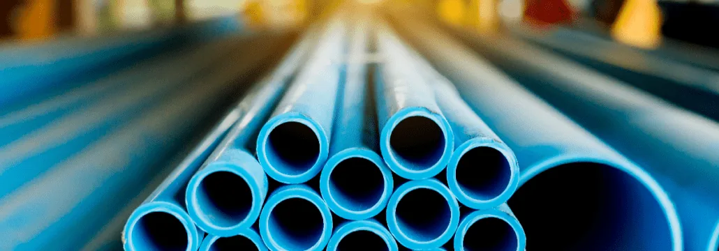 End-on view of a stack of blue plastic pipes